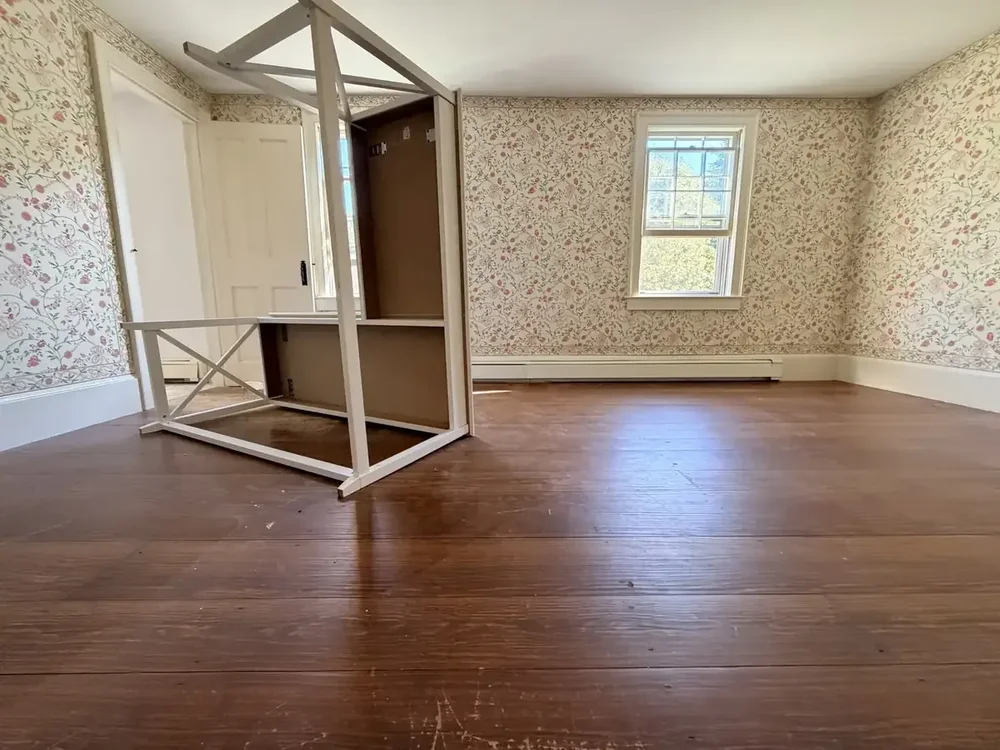 Floral wallpaper bedroom before refinishing