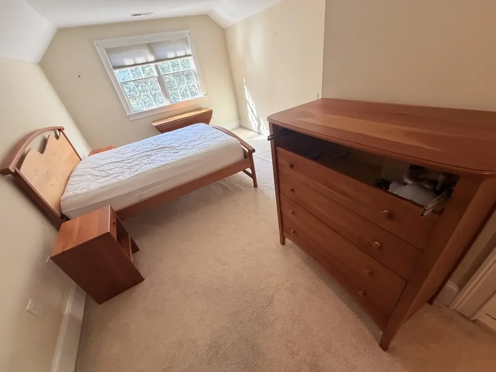 Rear bedroom with furniture returned before the Wellesley flooring project