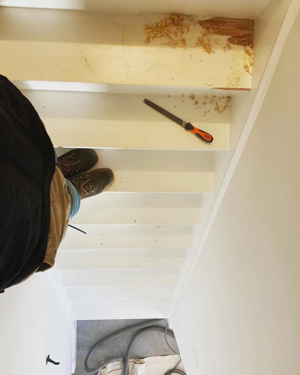 Paint being removed from wood stair treads