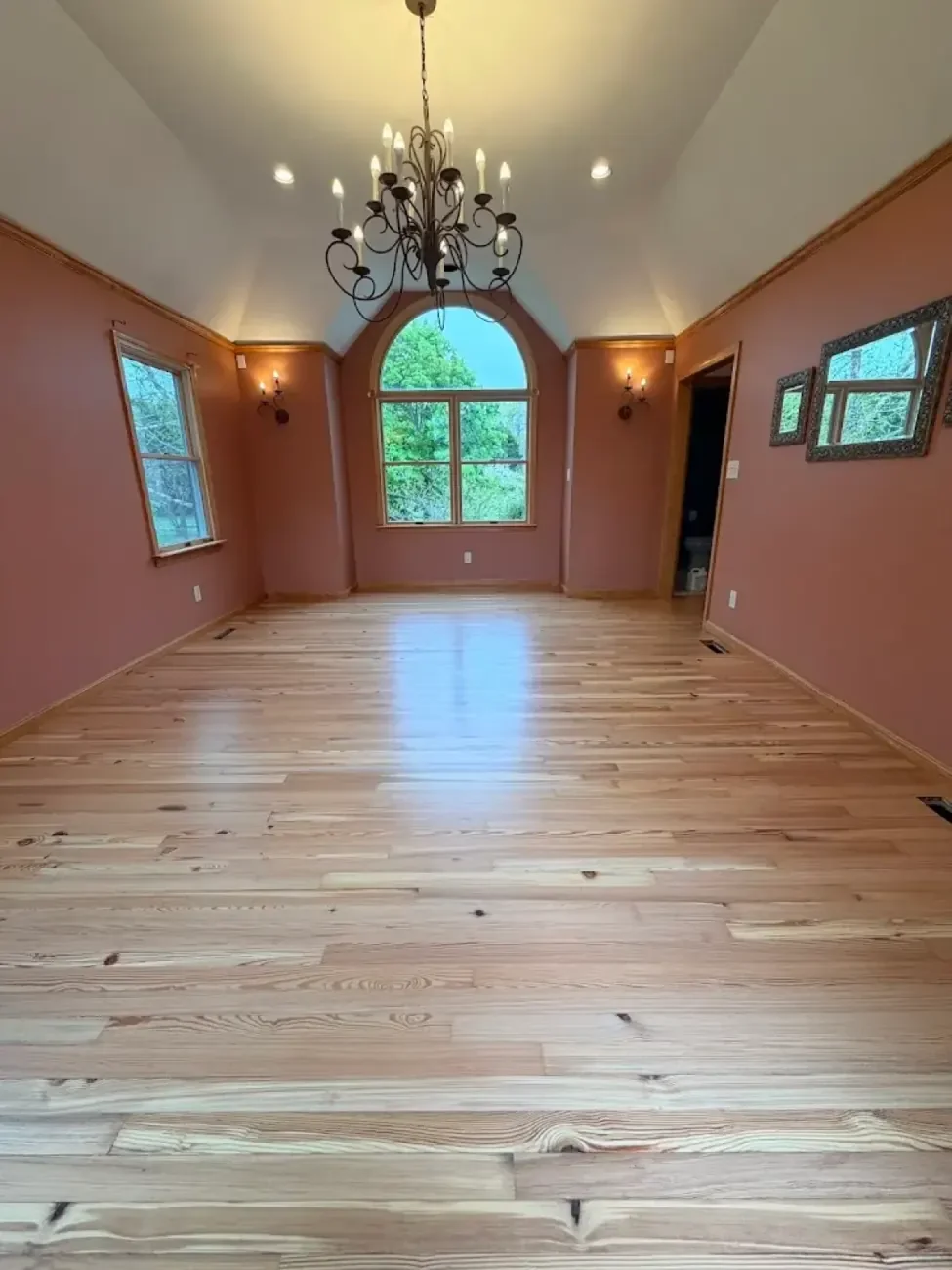 Same room after hardwood refinishing with a light natural finish