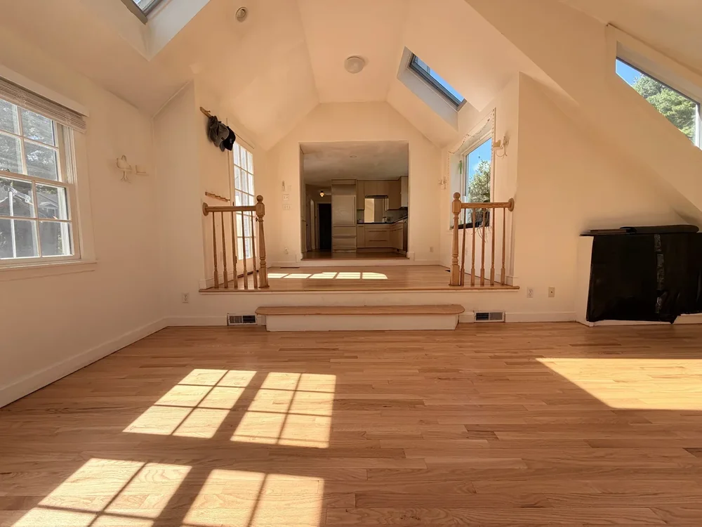 Sunroom after hardwood floor sanding and refinishing in Concord