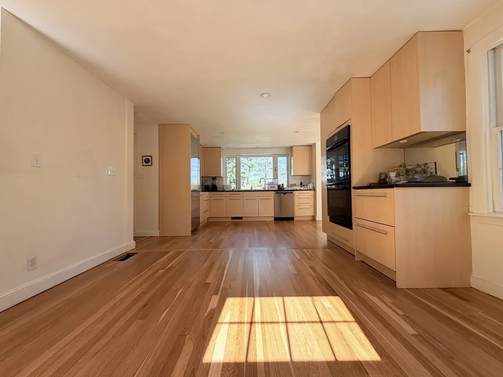 Kitchen after hardwood floor sanding and refinishing in Concord