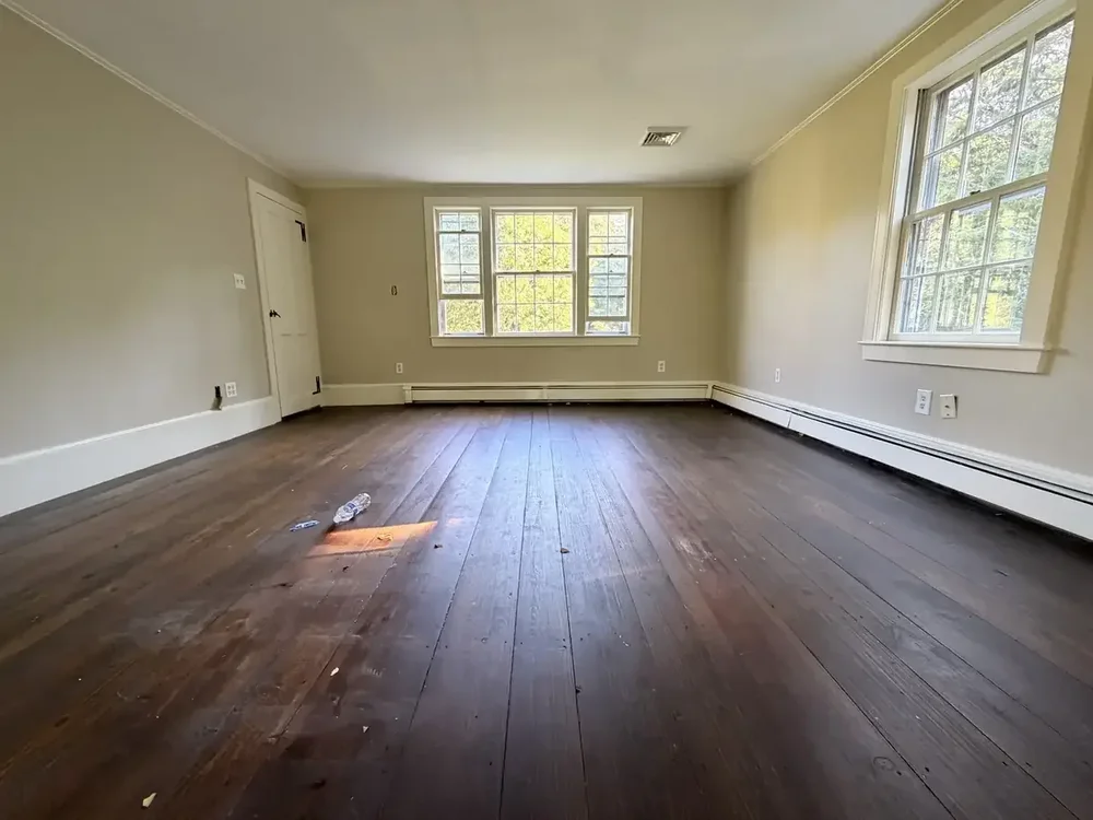 Large upstairs room before refinishing