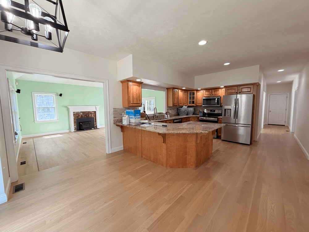 Completed white oak floor in an Accolade Flooring kitchen project