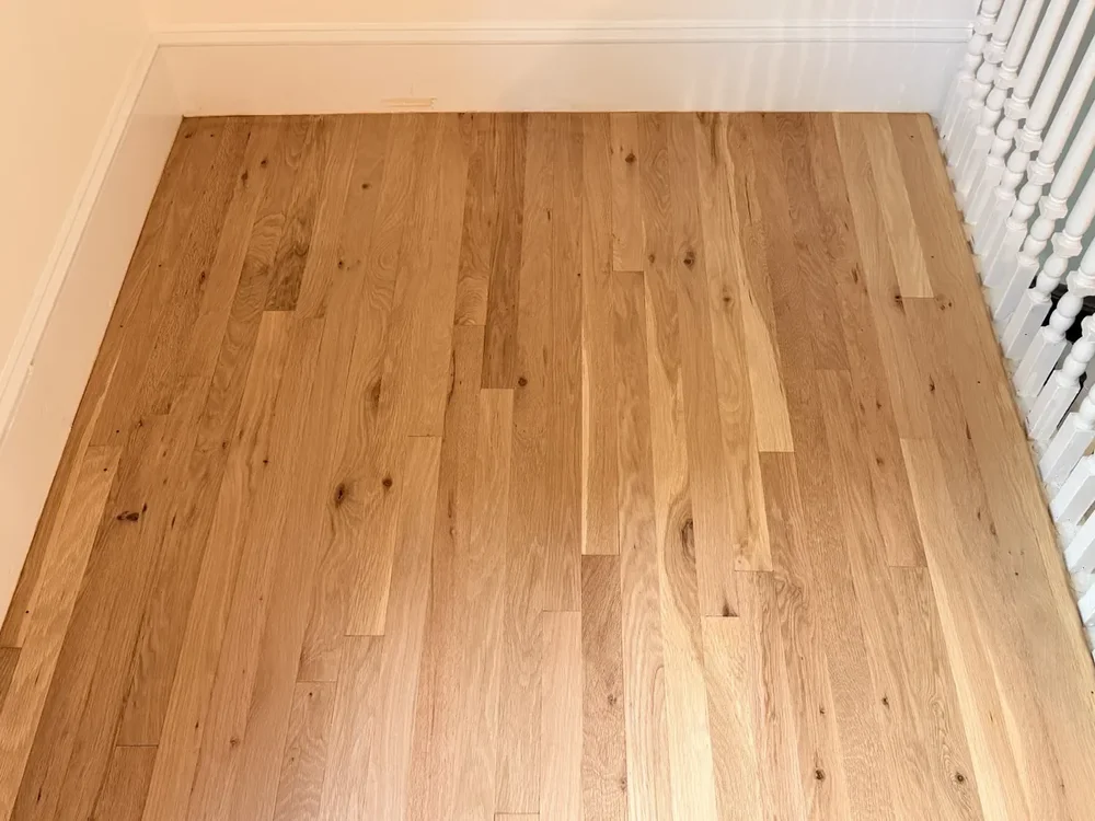 The stair landing after refinishing