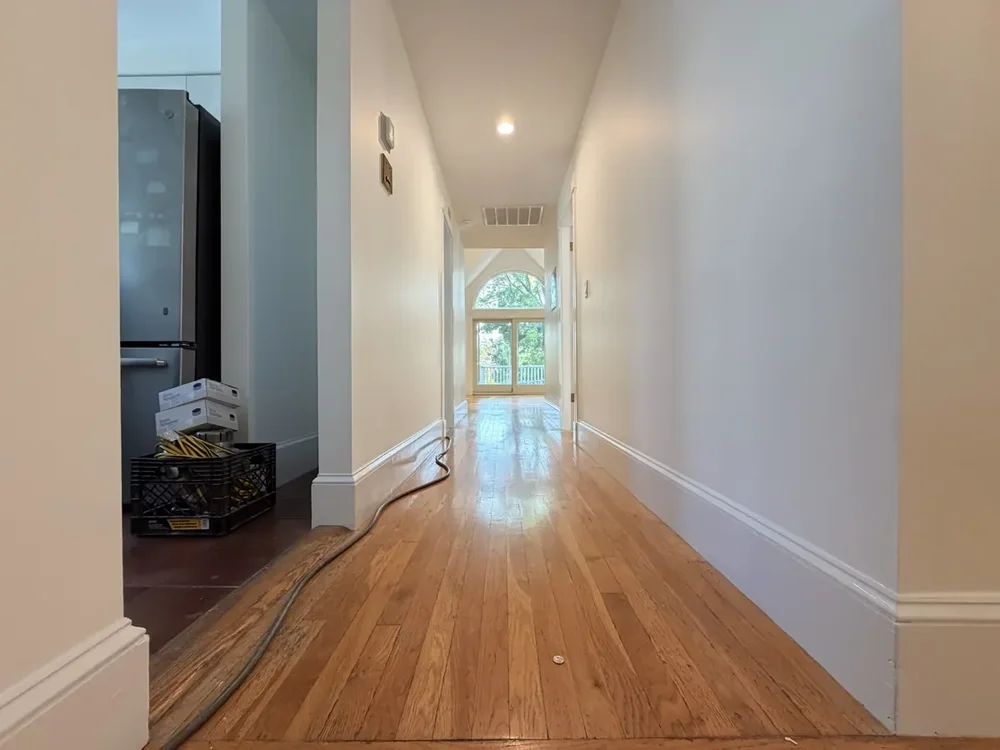 The connecting hallway before refinishing