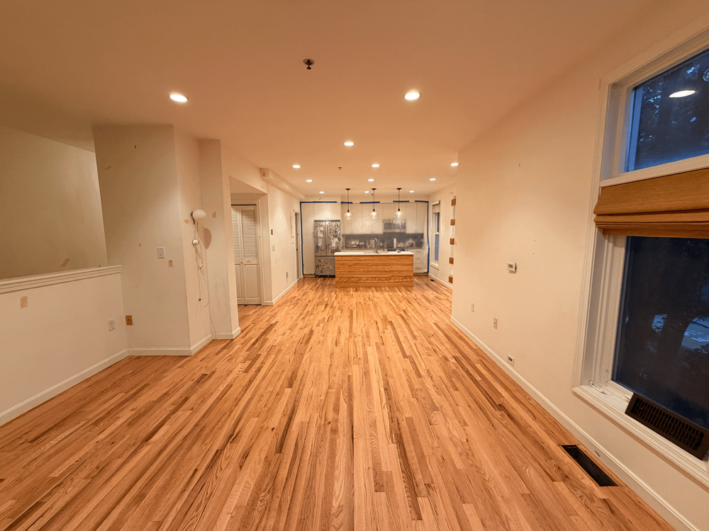 Cambridge living-to-kitchen view after refinishing