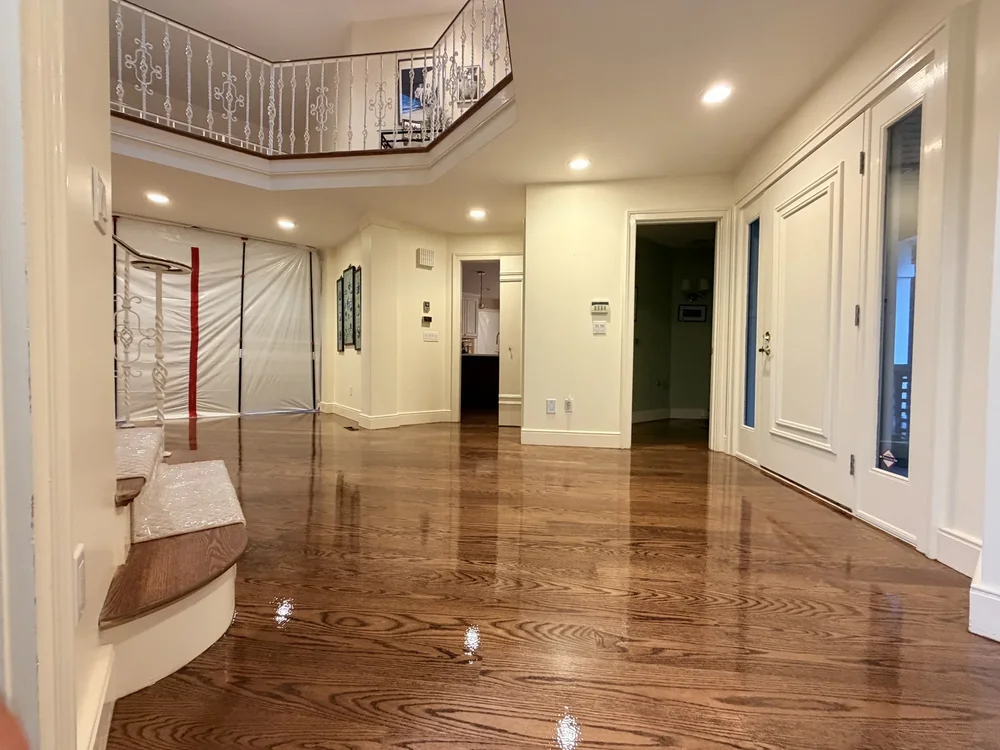 The same Wayland foyer after white oak sanding, staining, and finishing