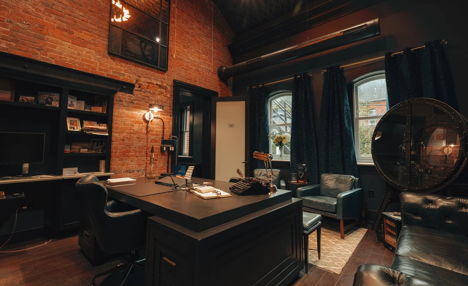 A private office with a large desk by the window