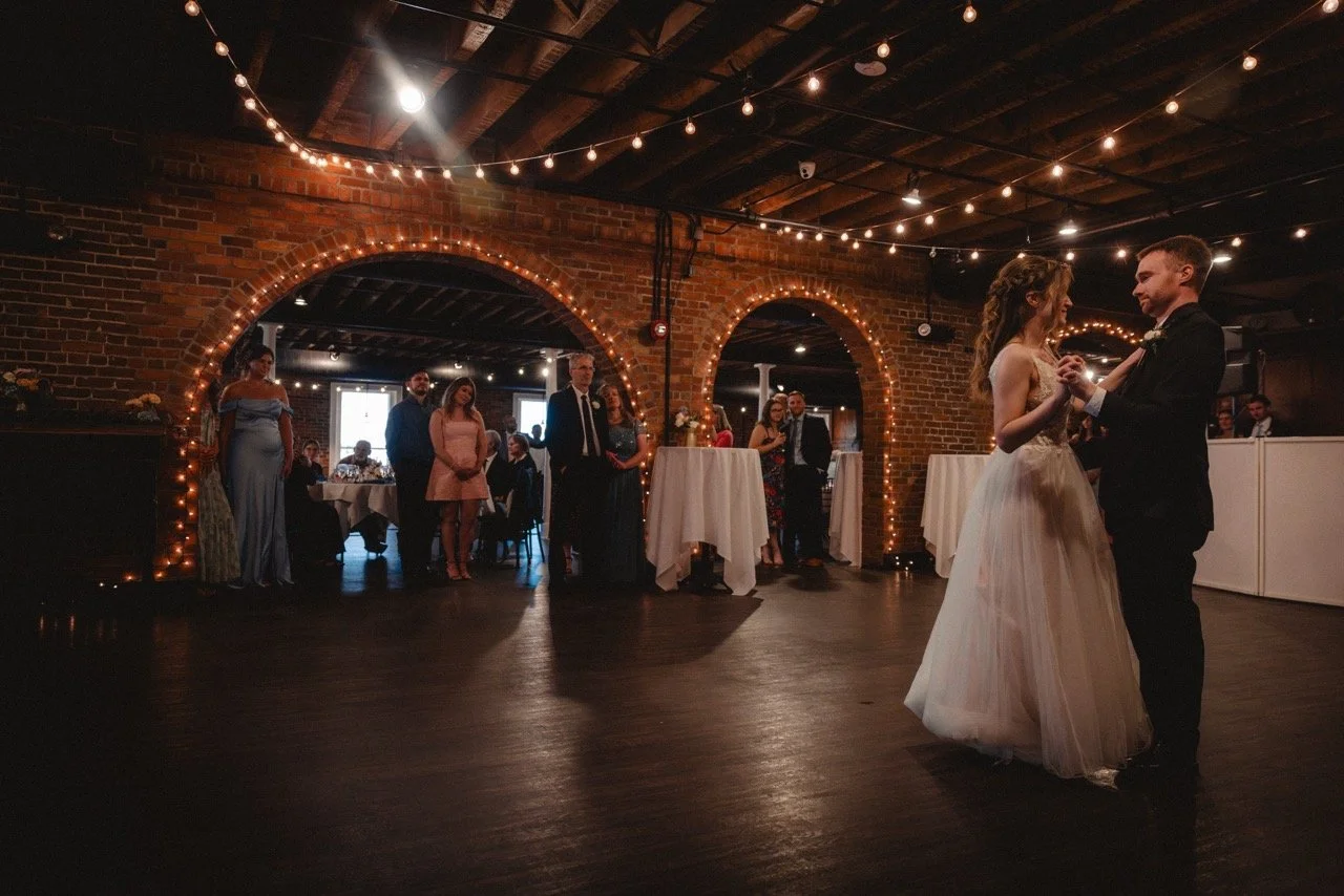Guests dancing at a candlelit reception
