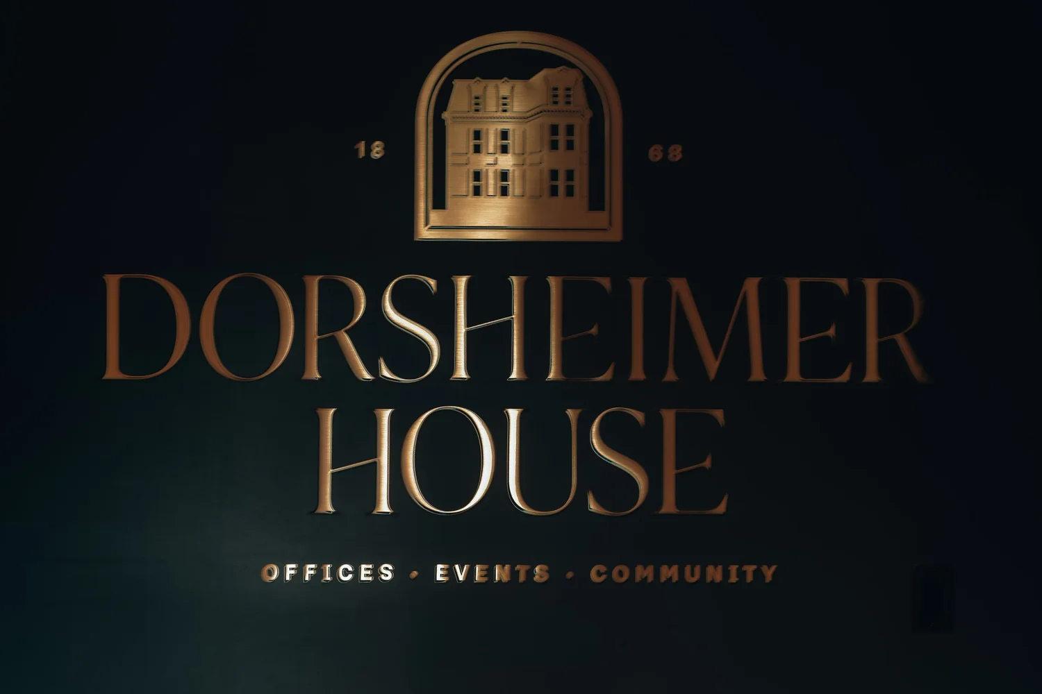 The Dorsheimer House sign on a dark wall