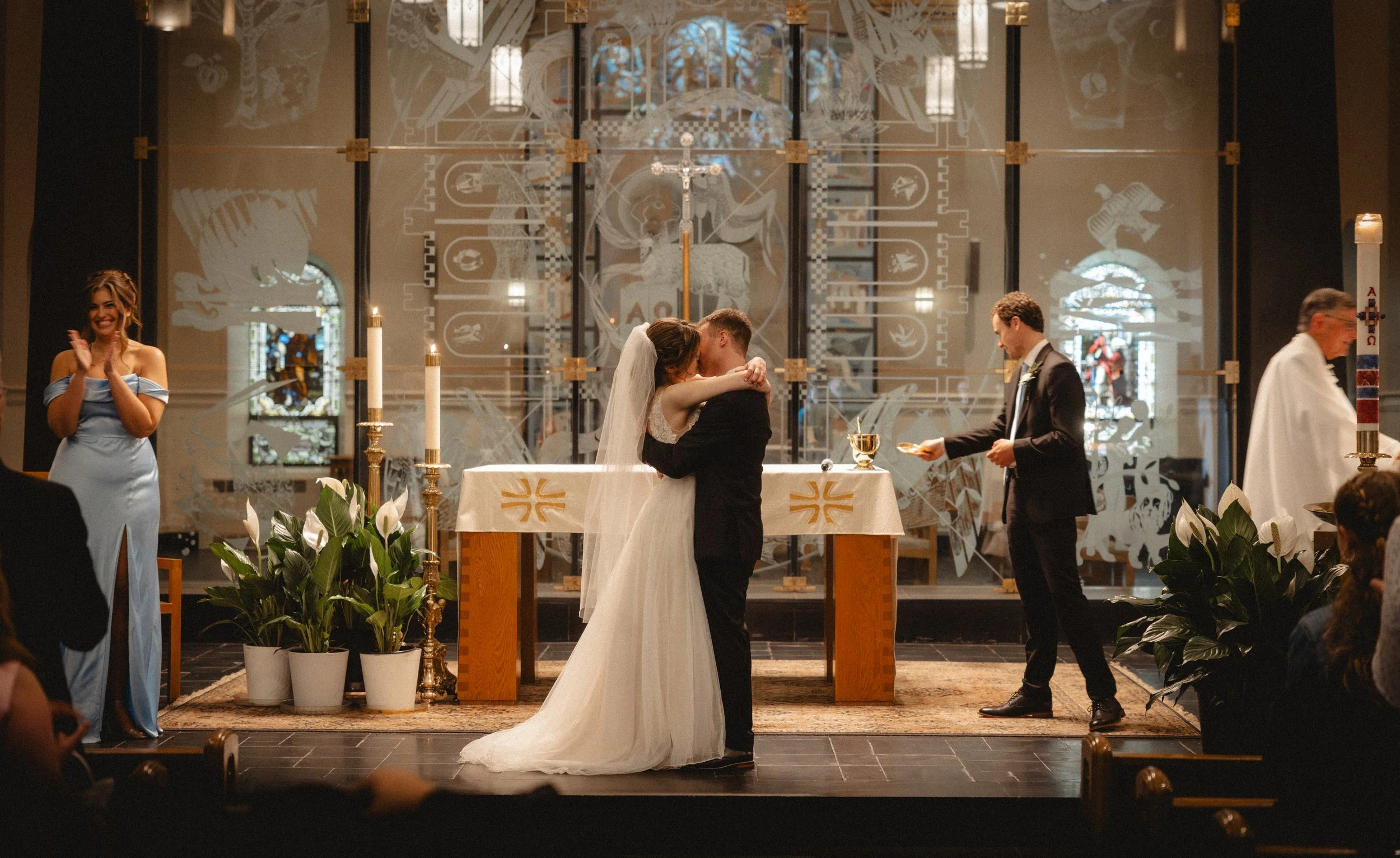 A couple at the altar of a church during their ceremony