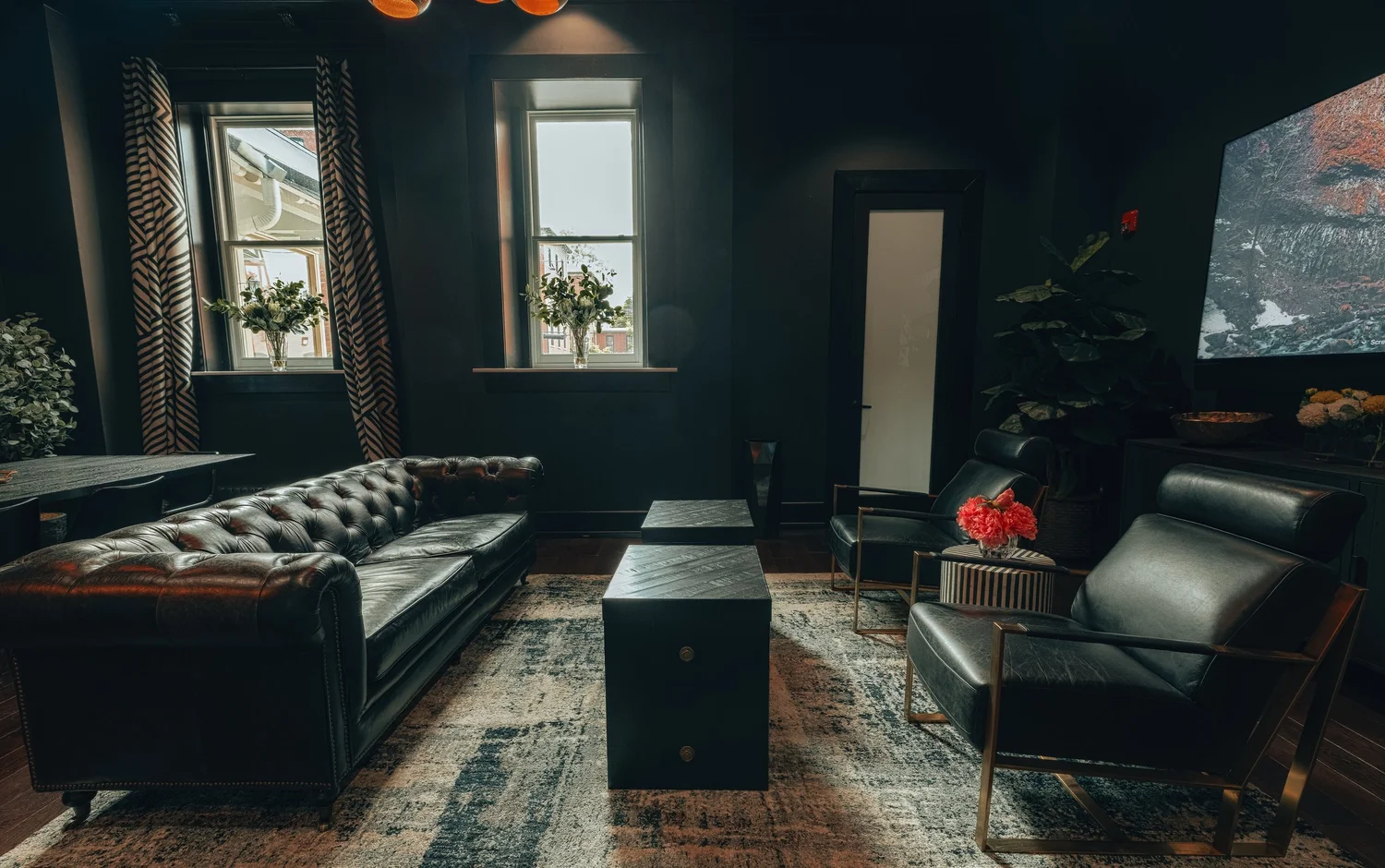 Leather sofas arranged around a coffee trunk