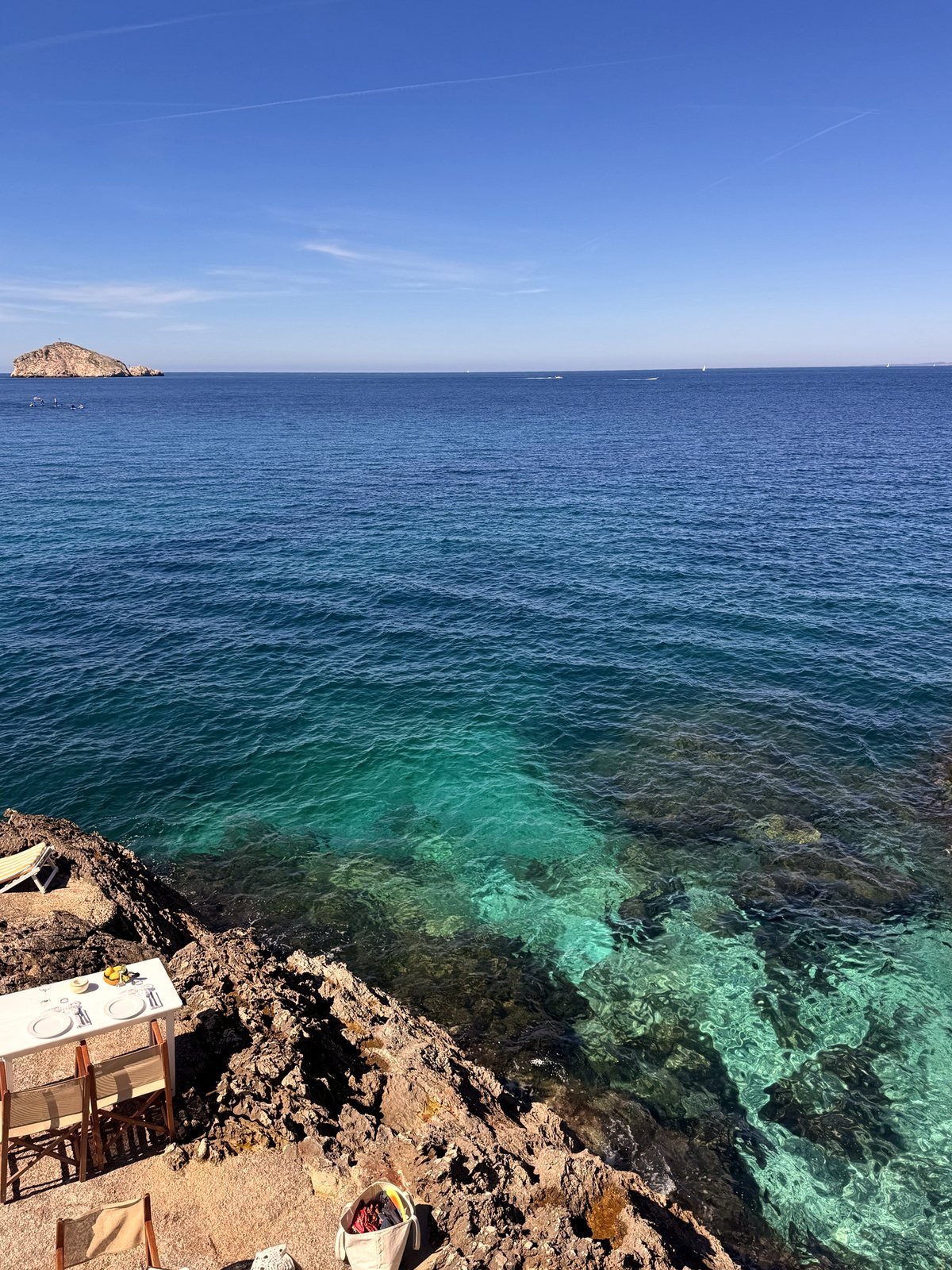 Turquoise water below a seaside terrace