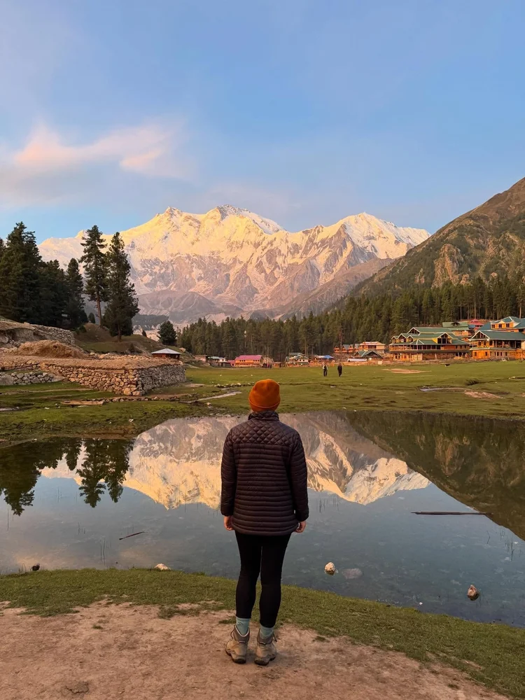 person facing a mountain