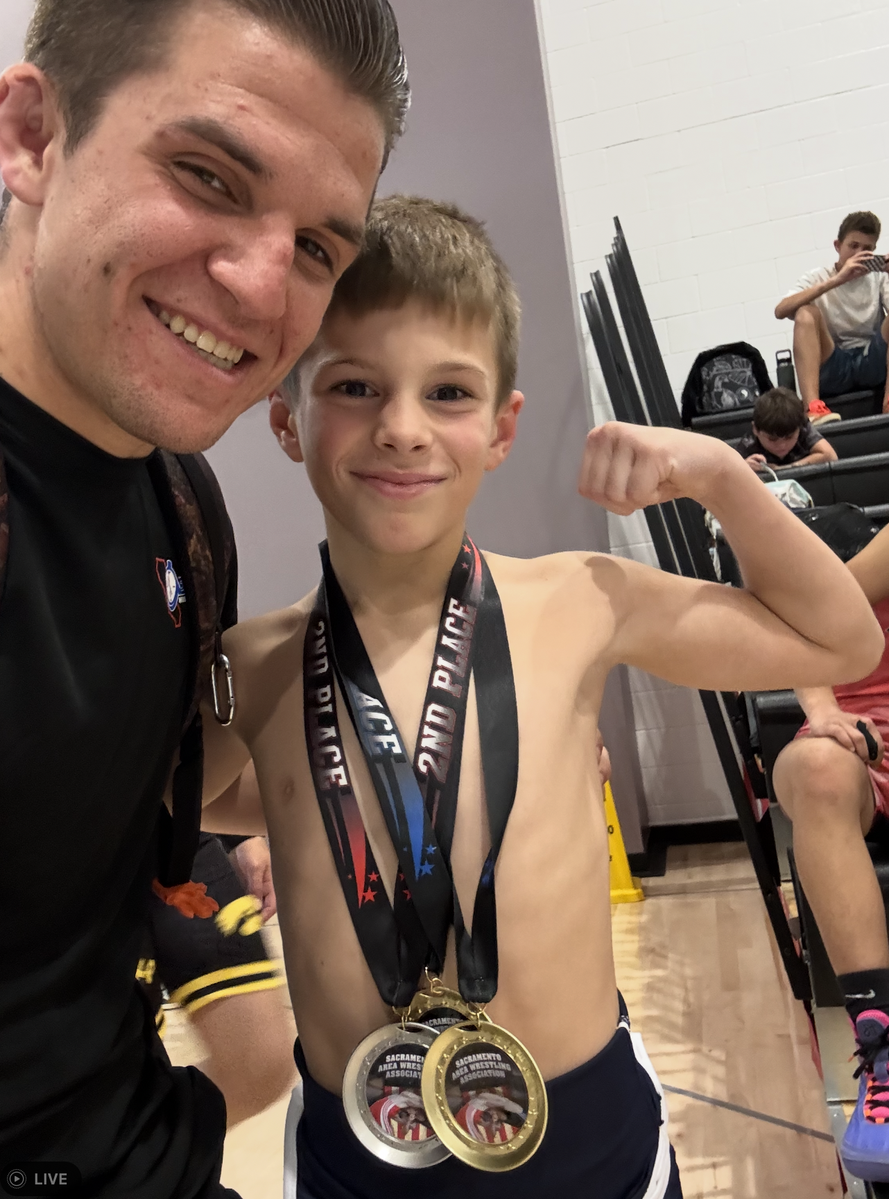 Wrestler with 2nd place medals