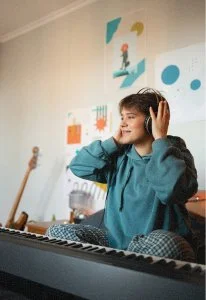 Teen focused on building or creating something