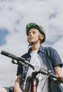 Teen riding a mountain bike on a trail