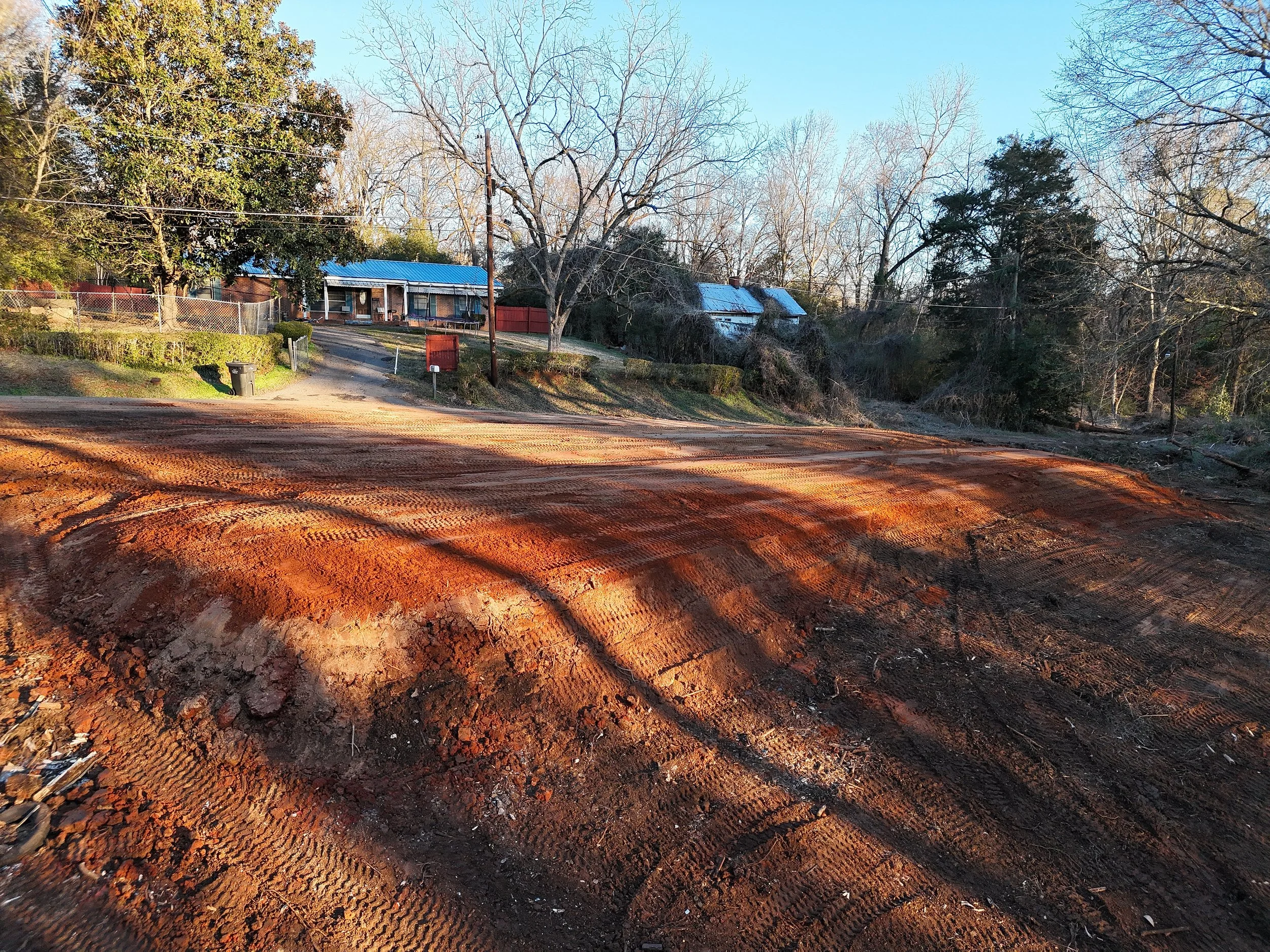 Slope backfilled to create a level building pad