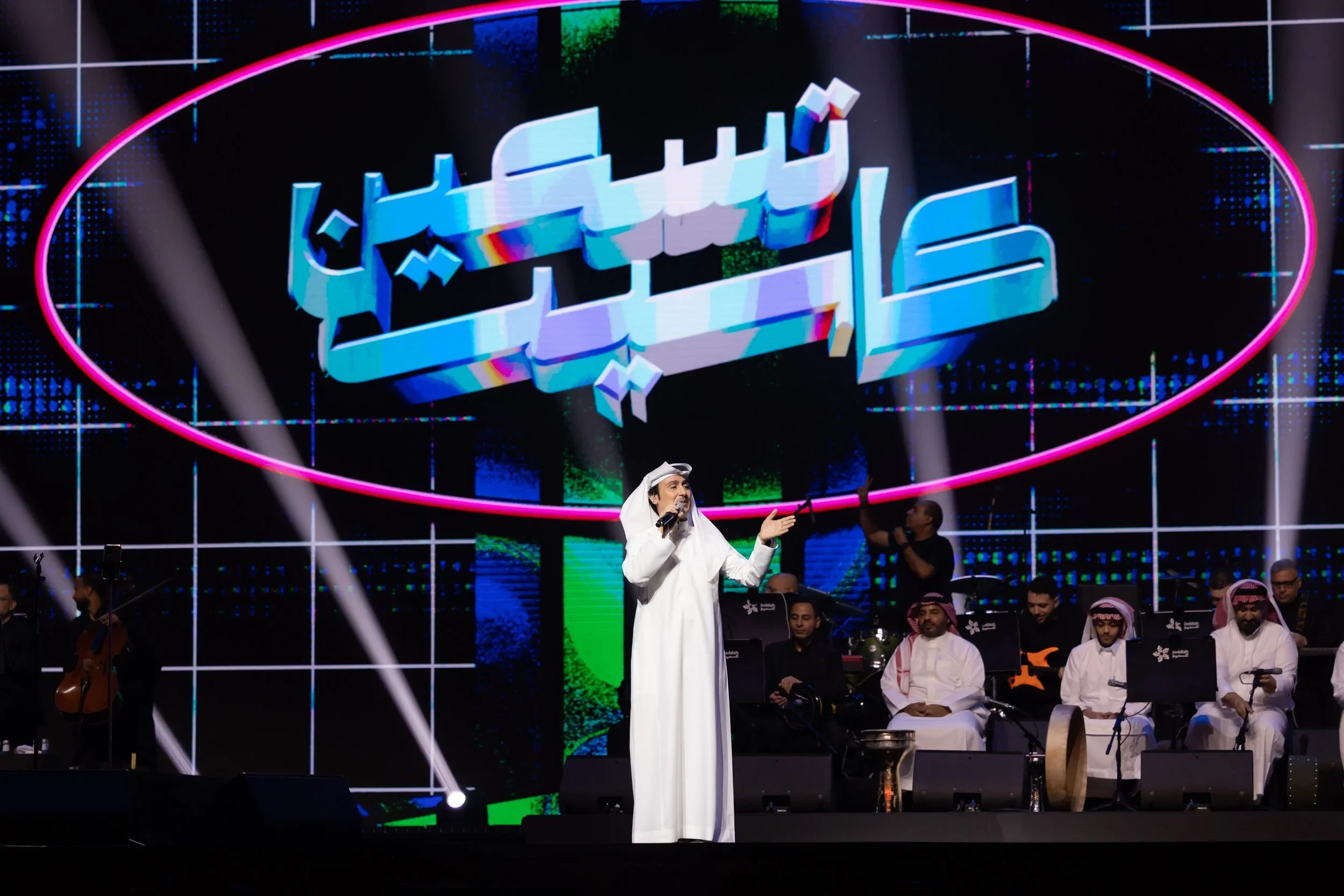 Cassette 90 stage with neon Arabic signage
