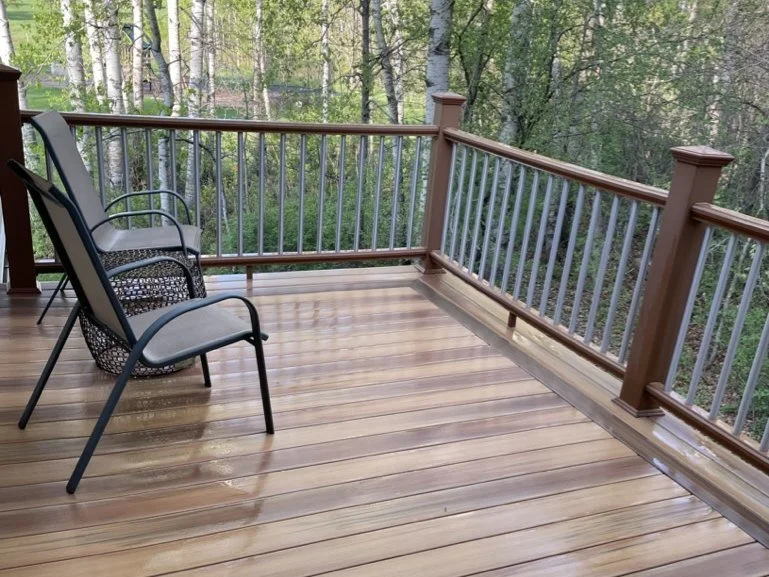 Composite deck among birch trees