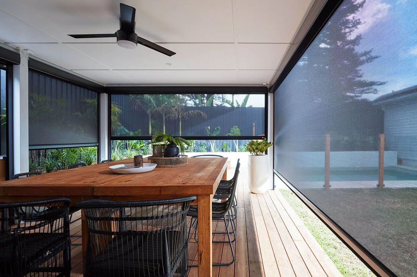 Outdoor blinds enclosing a patio entertaining area
