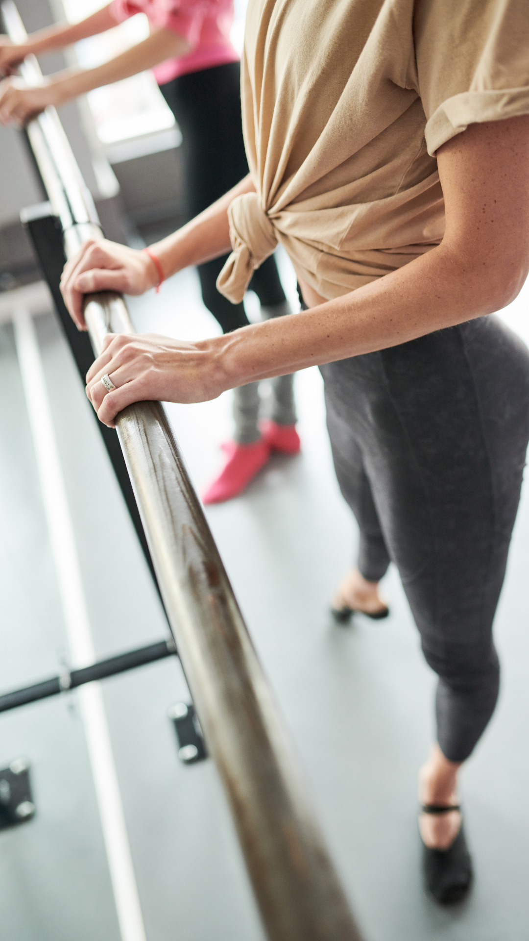 Hands at the barre during a Beyond the Barre class