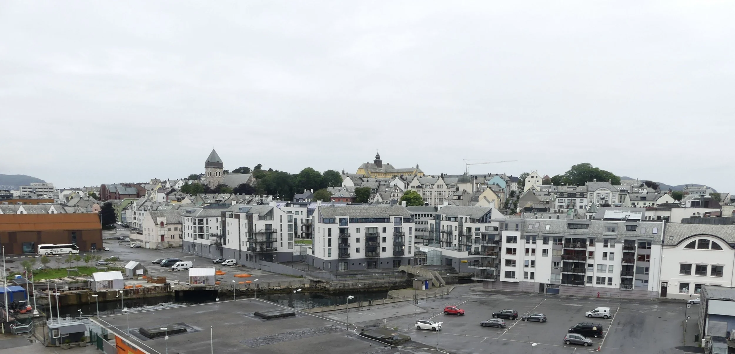 Ålesund from above — art-nouveau rooftops ringing the water.