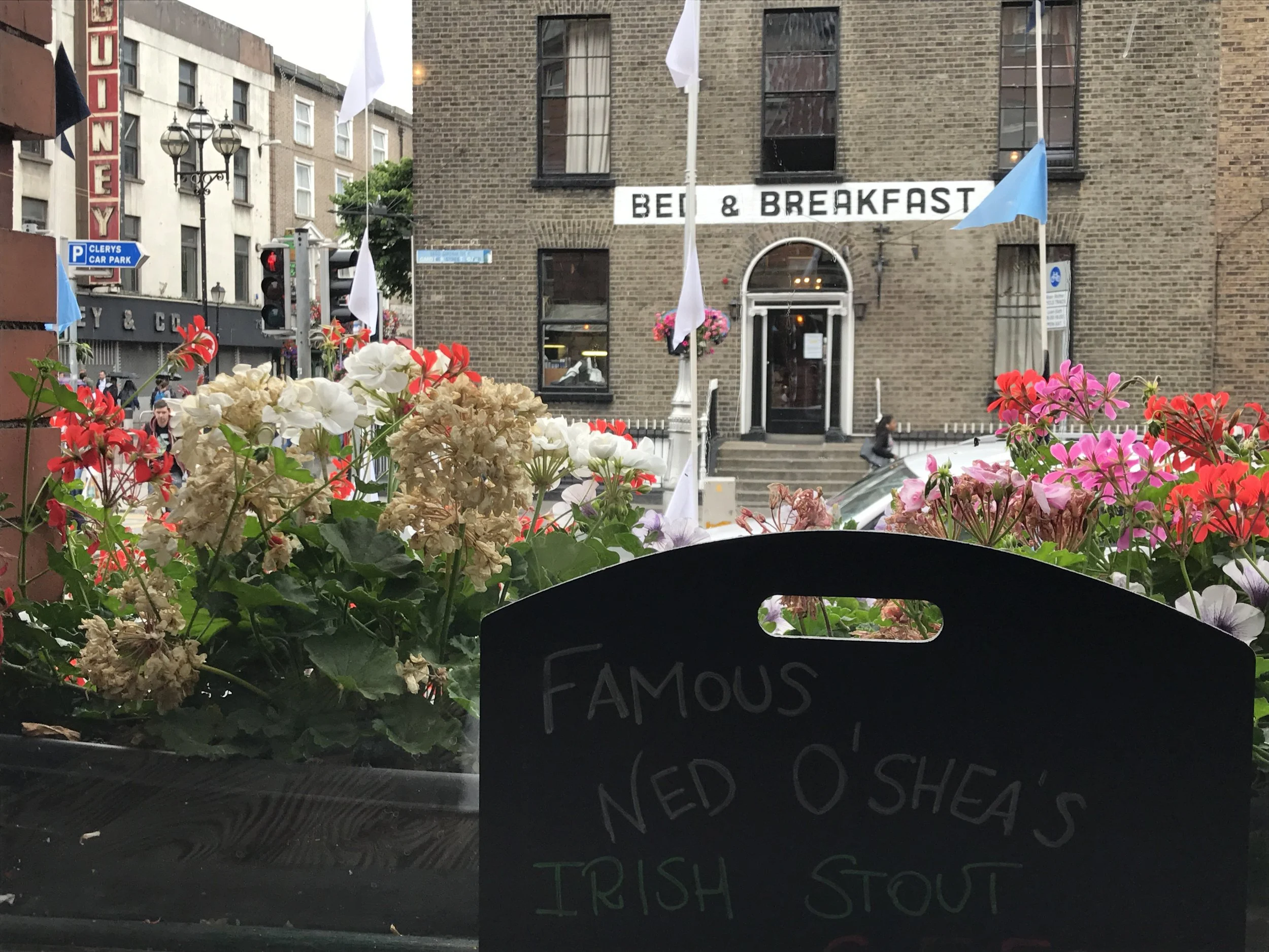Flower baskets outside O'Shea's pub.