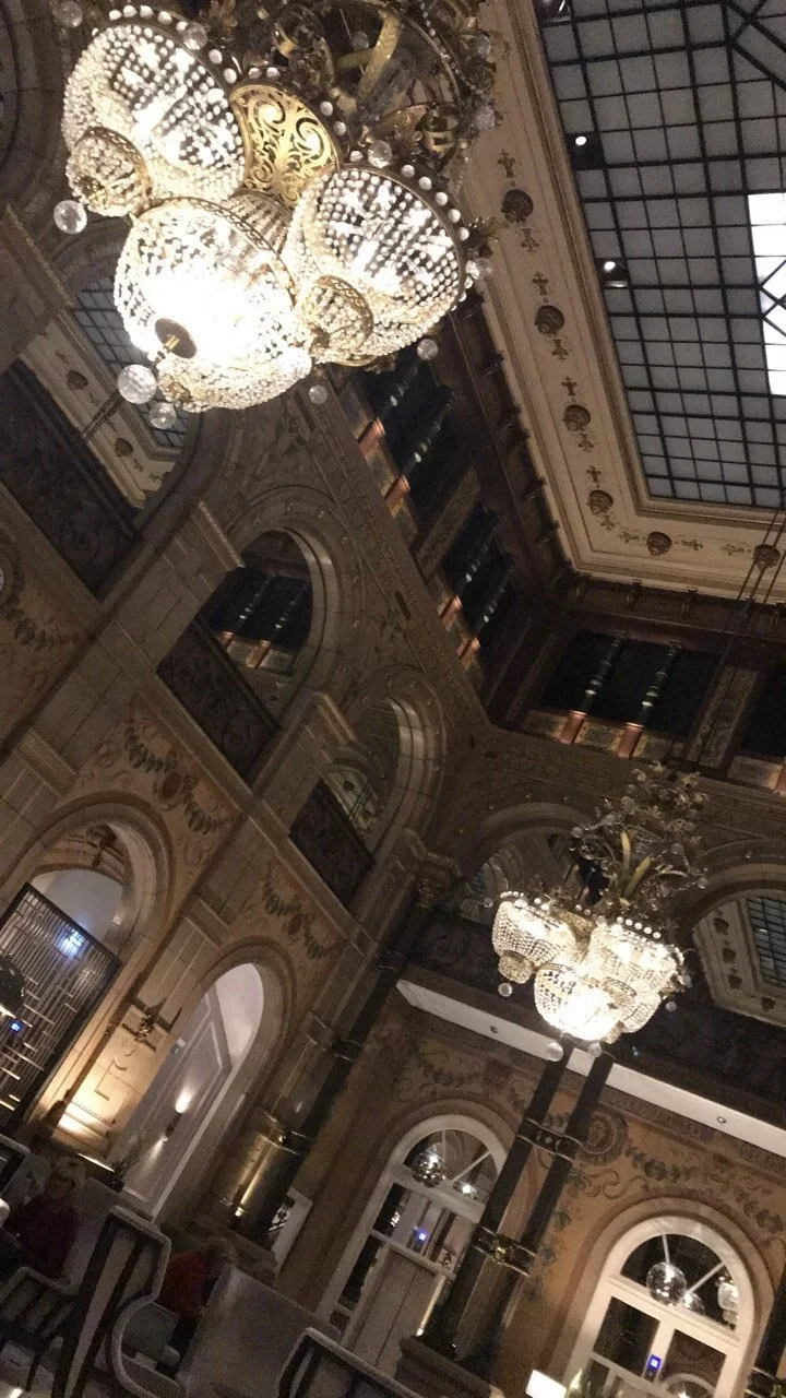 The glass dome and chandeliers inside Galeries Lafayette.