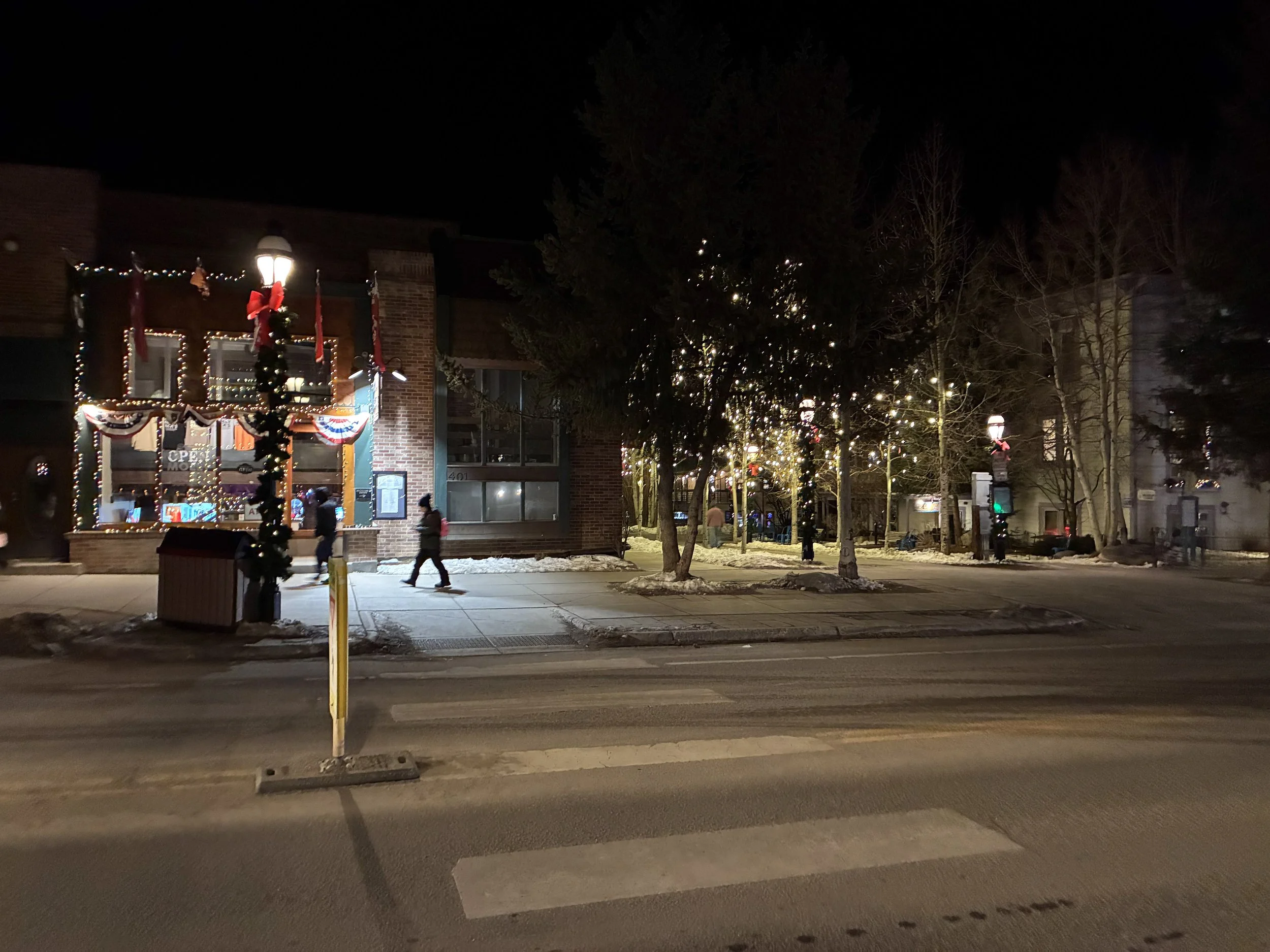 Main Street in its holiday lights at night.