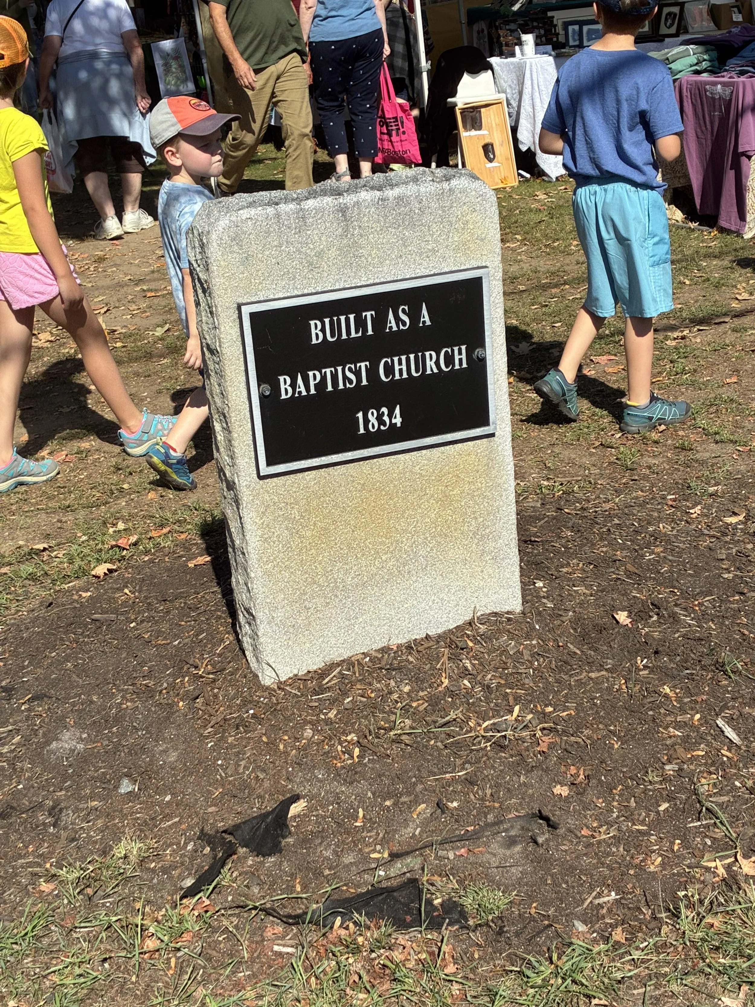 A stone marker reading 'Built as a Baptist Church 1834'.