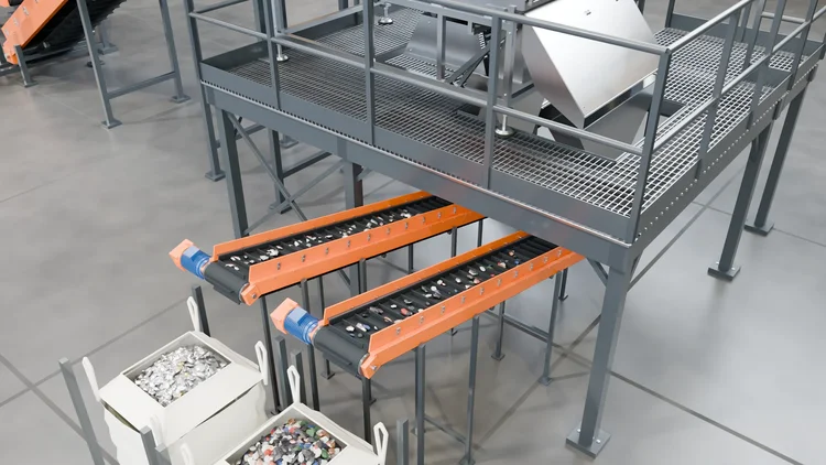 Output conveyors and collection bags beneath the sorter platform