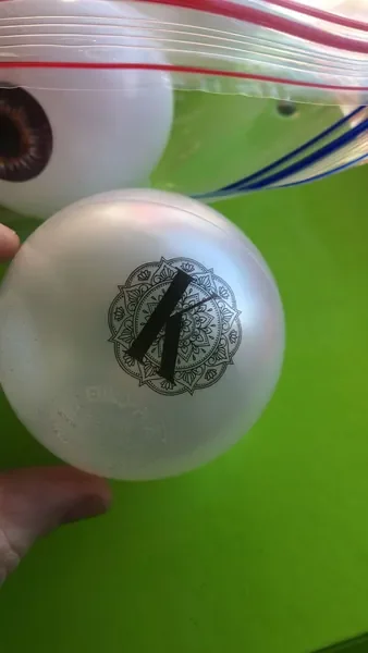 Single-colour black design printed on a pearl ball