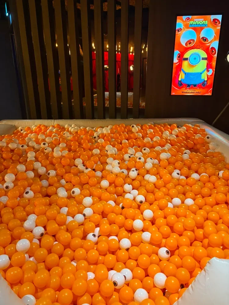 Custom-printed eyeball designs used throughout a ball pit for a Minions promotional event