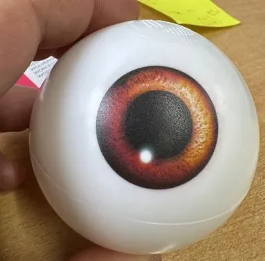 Close-up of a full-colour eyeball design printed on a white ball