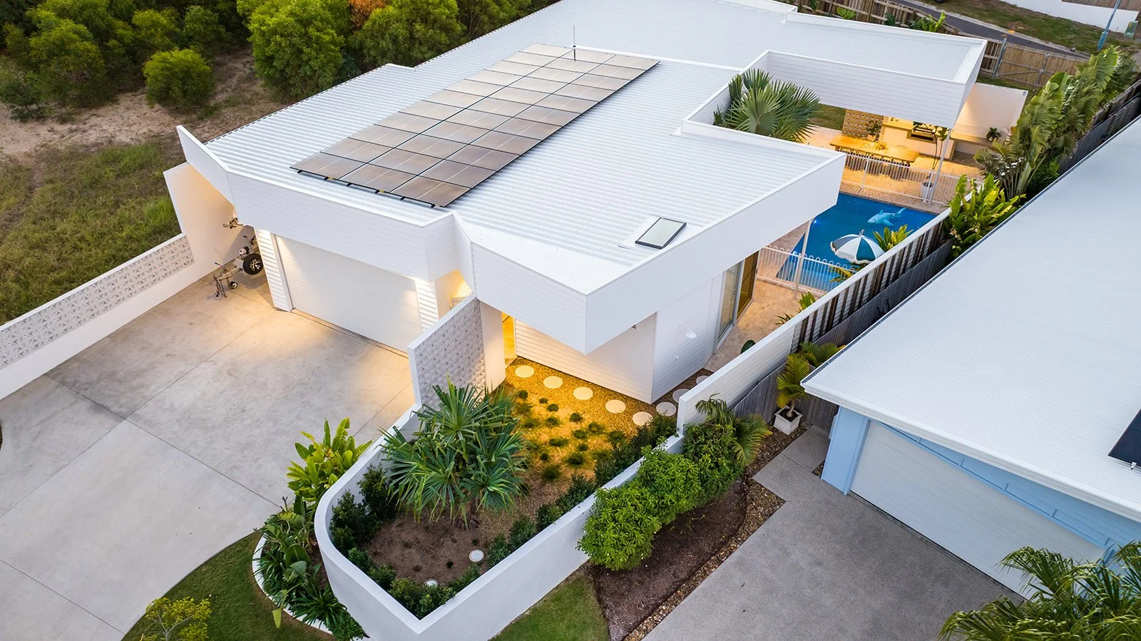 Aerial roof and entry view of the completed contemporary coastal Queensland residence