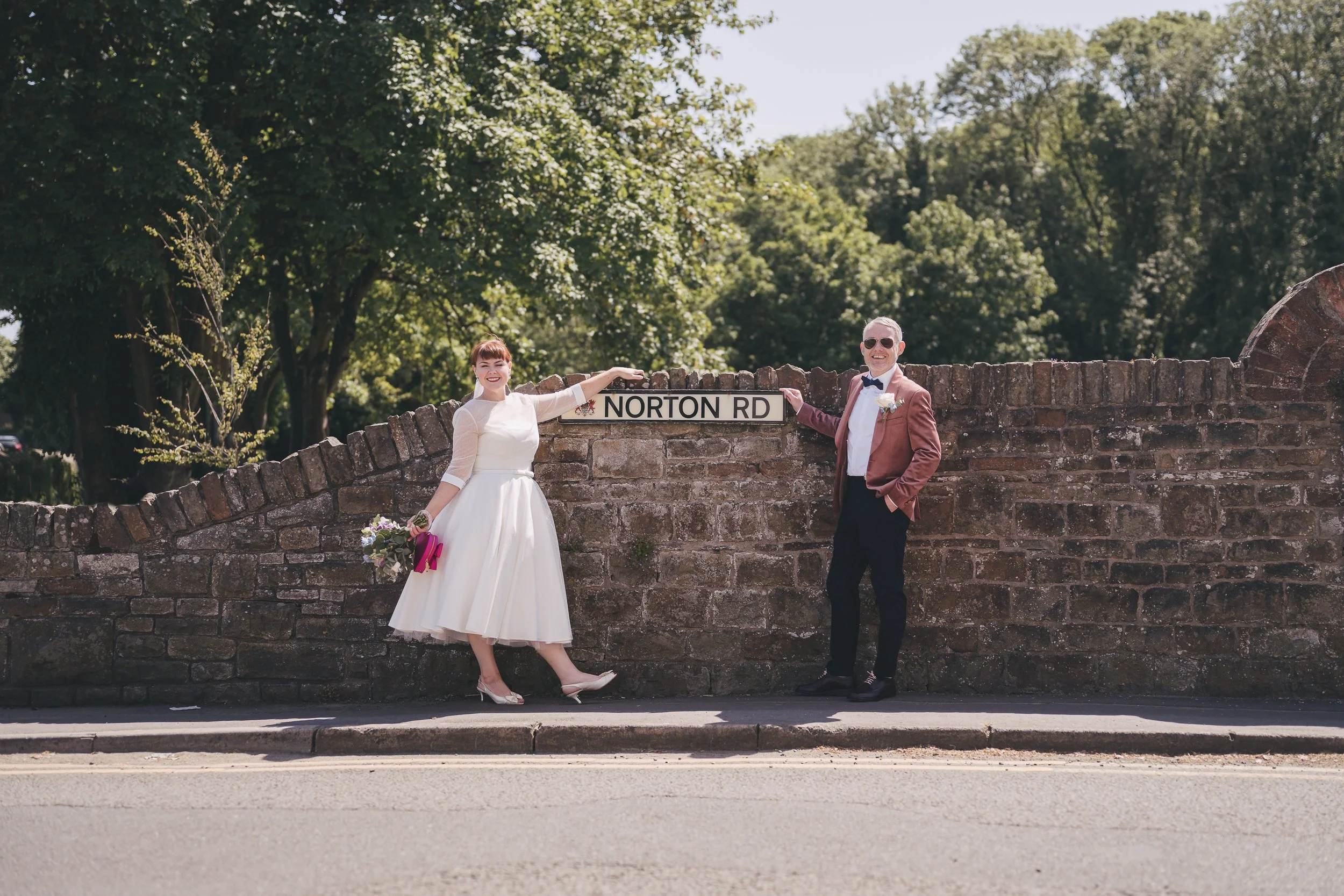 Maggie and Rhys celebrating outside Norton House Hotel in Mumbles