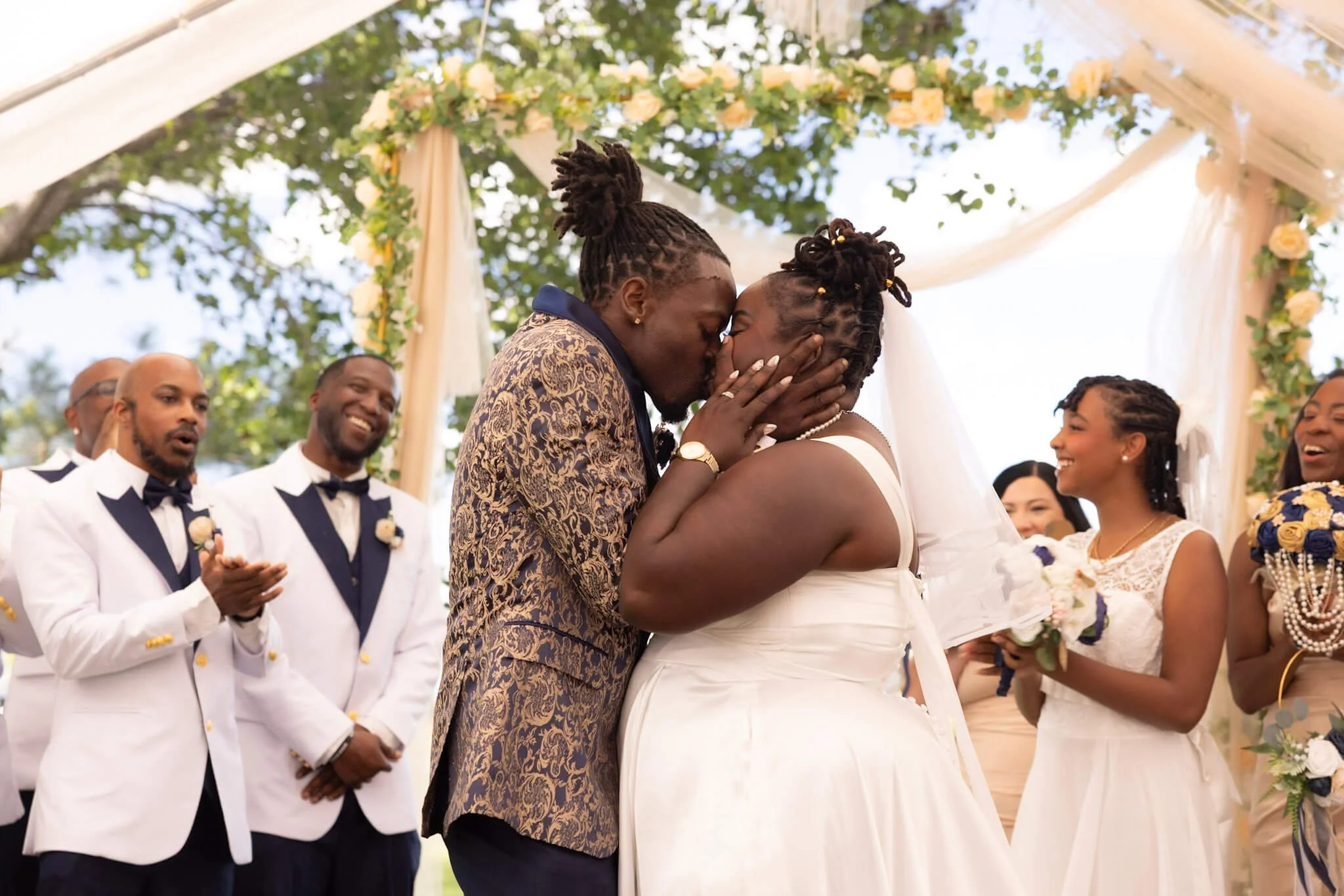 Bride and groom sharing an unplanned affectionate wedding-day moment
