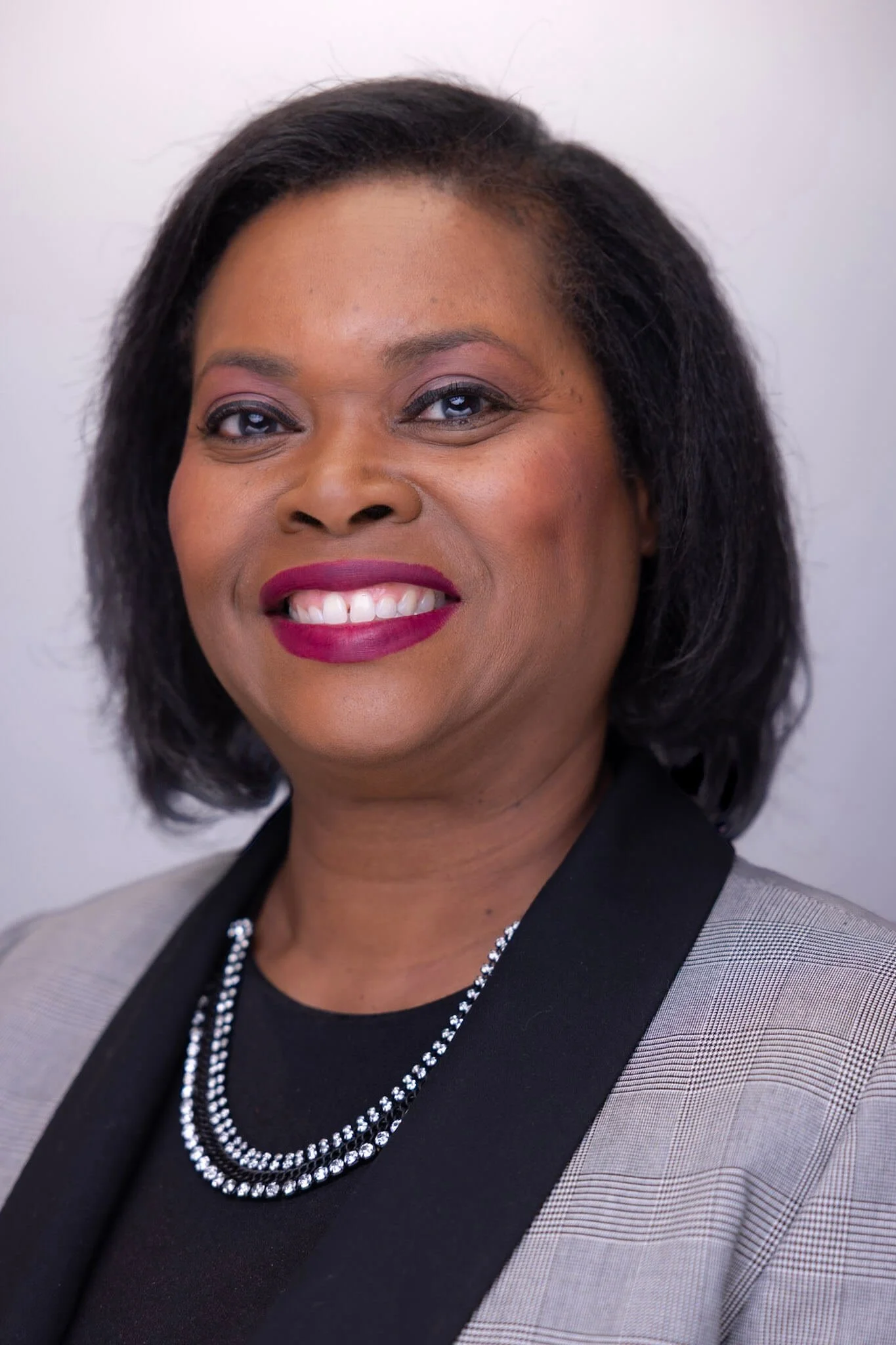 Professional individual headshot of a woman for business use