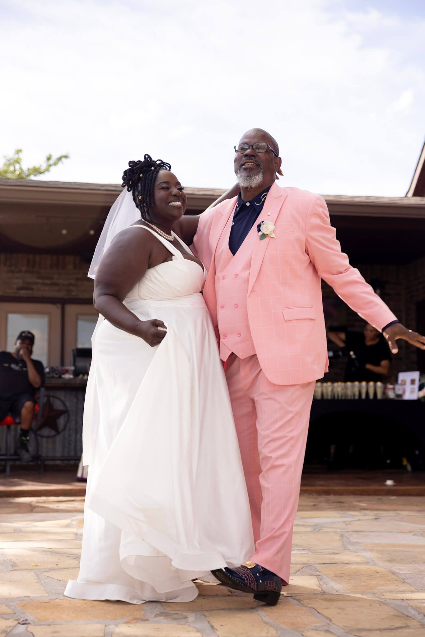 Bride and groom dancing together during their wedding celebration