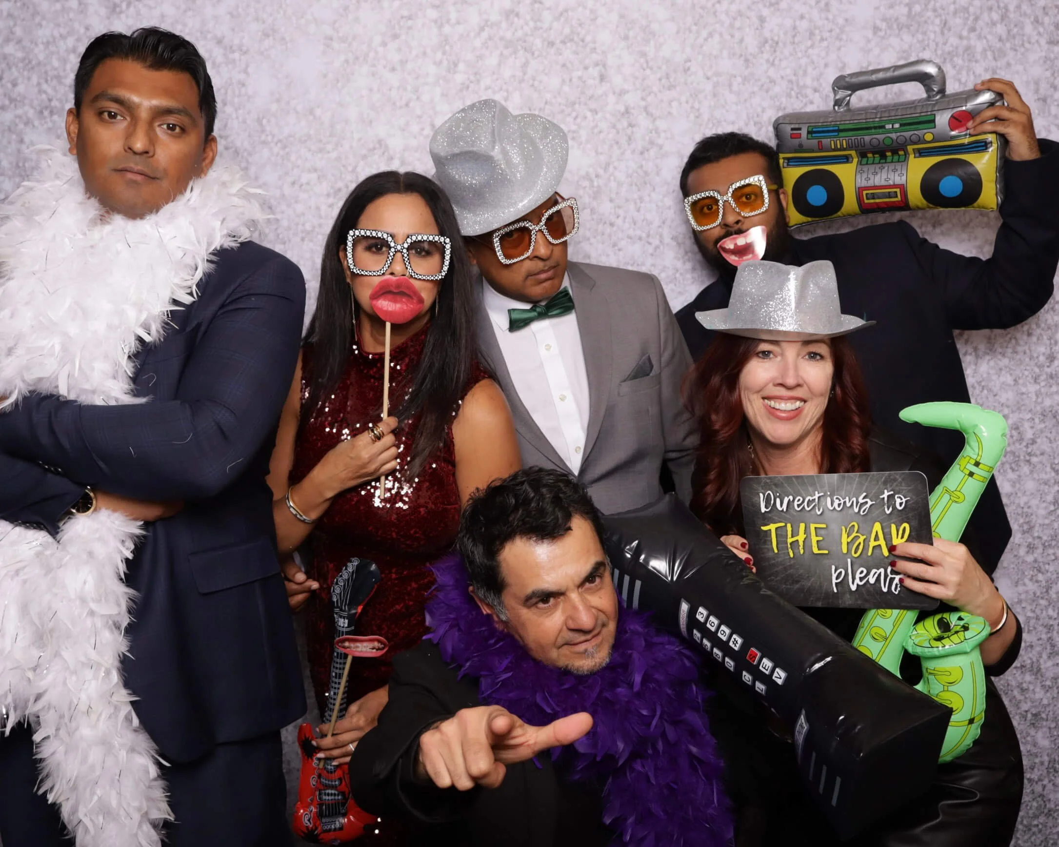 Guests enjoying a BeeCaptured photo booth experience at a corporate event