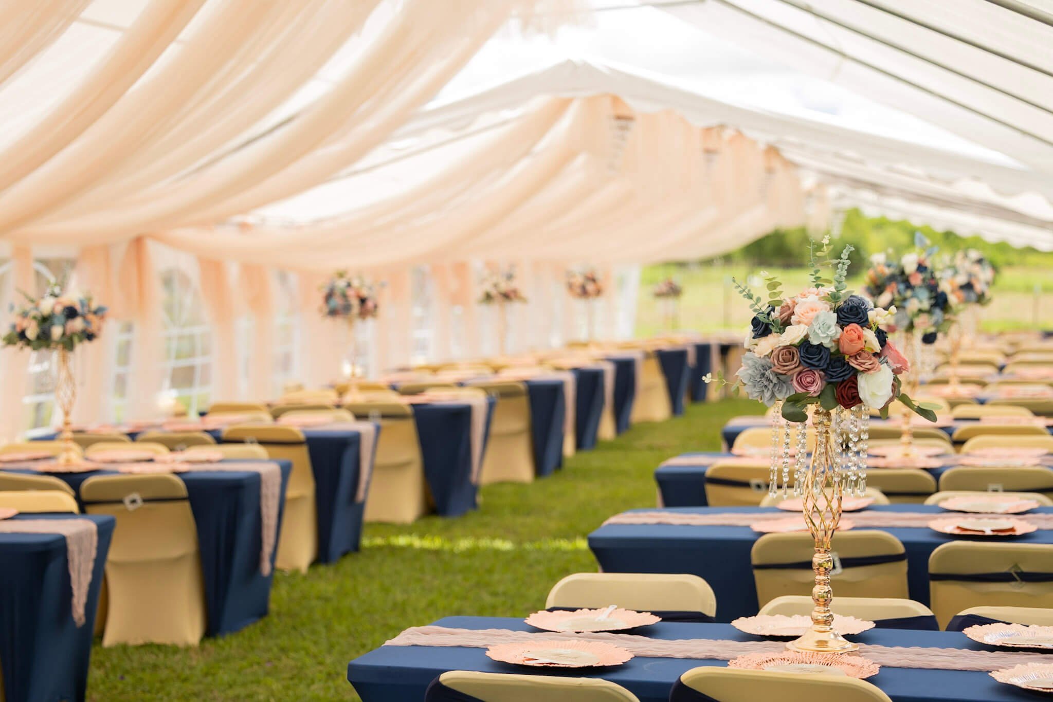 Wedding reception tent and floral table details photographed by BeeCaptured