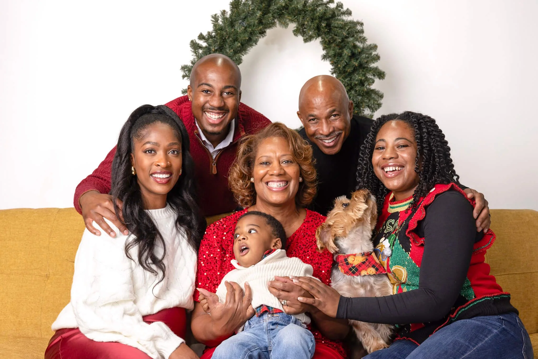 Family posing together during a professional photo booth session