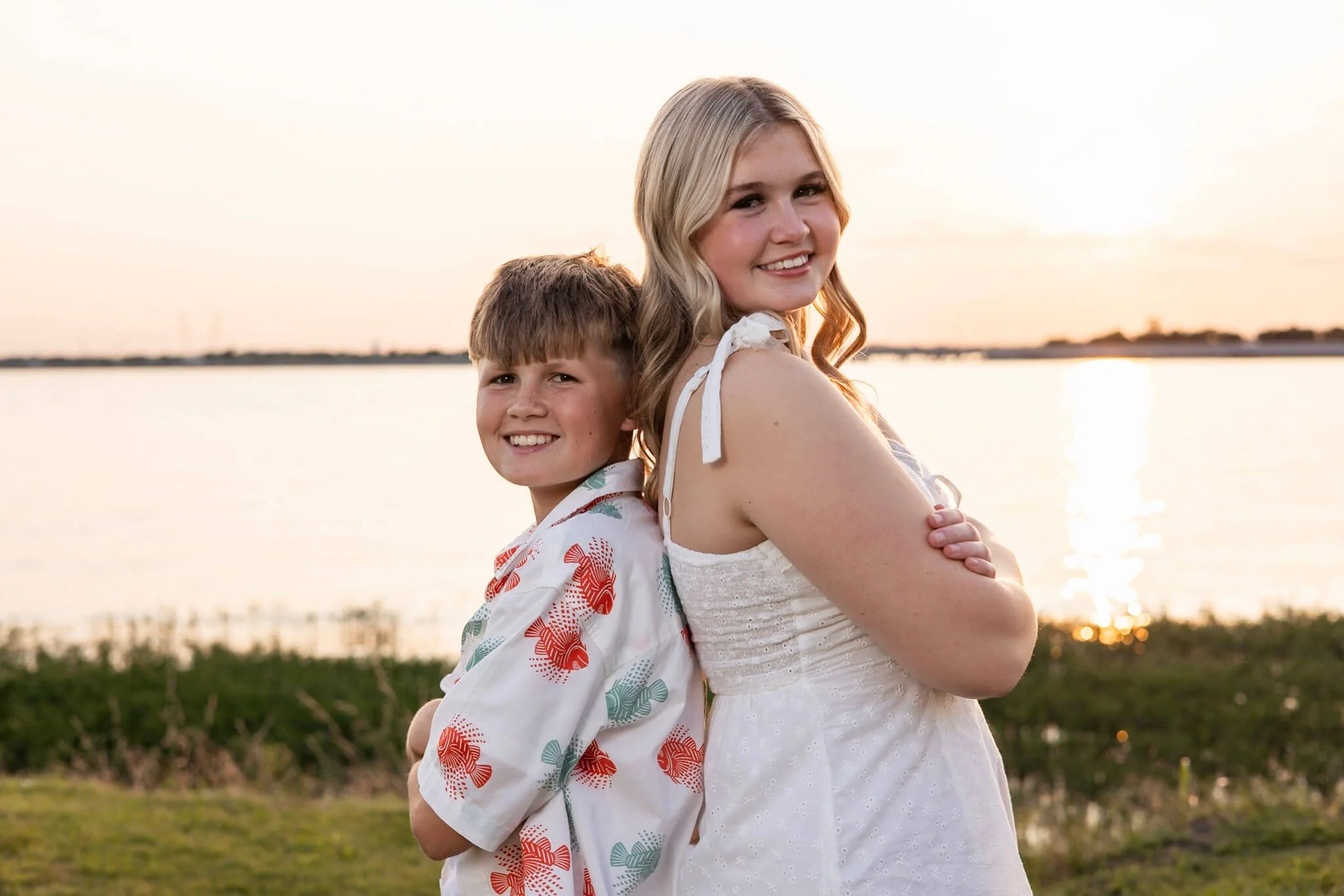 Mother and child photographed together outdoors by the water