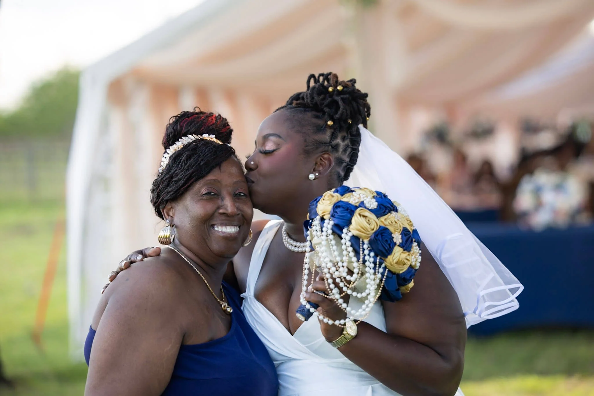 Bride sharing a joyful moment with family during a BeeCaptured wedding