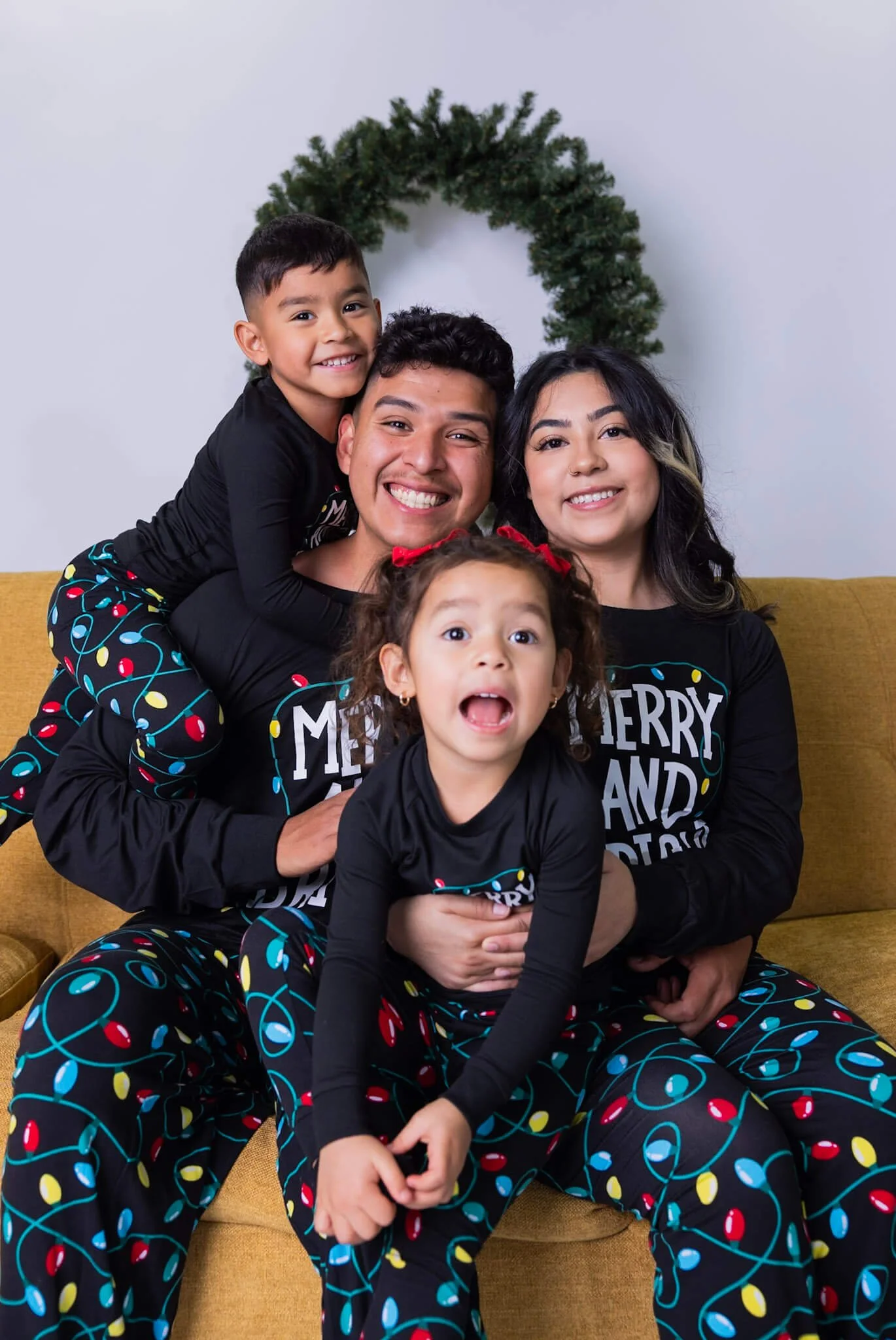 Children and family members posing together during a photo booth session