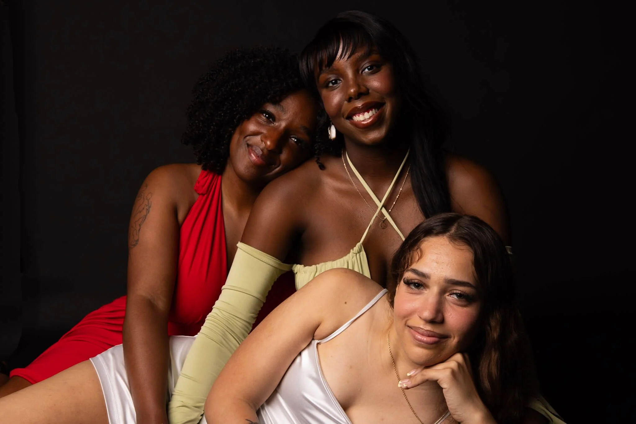 Friends photographed closely together in a lifestyle portrait