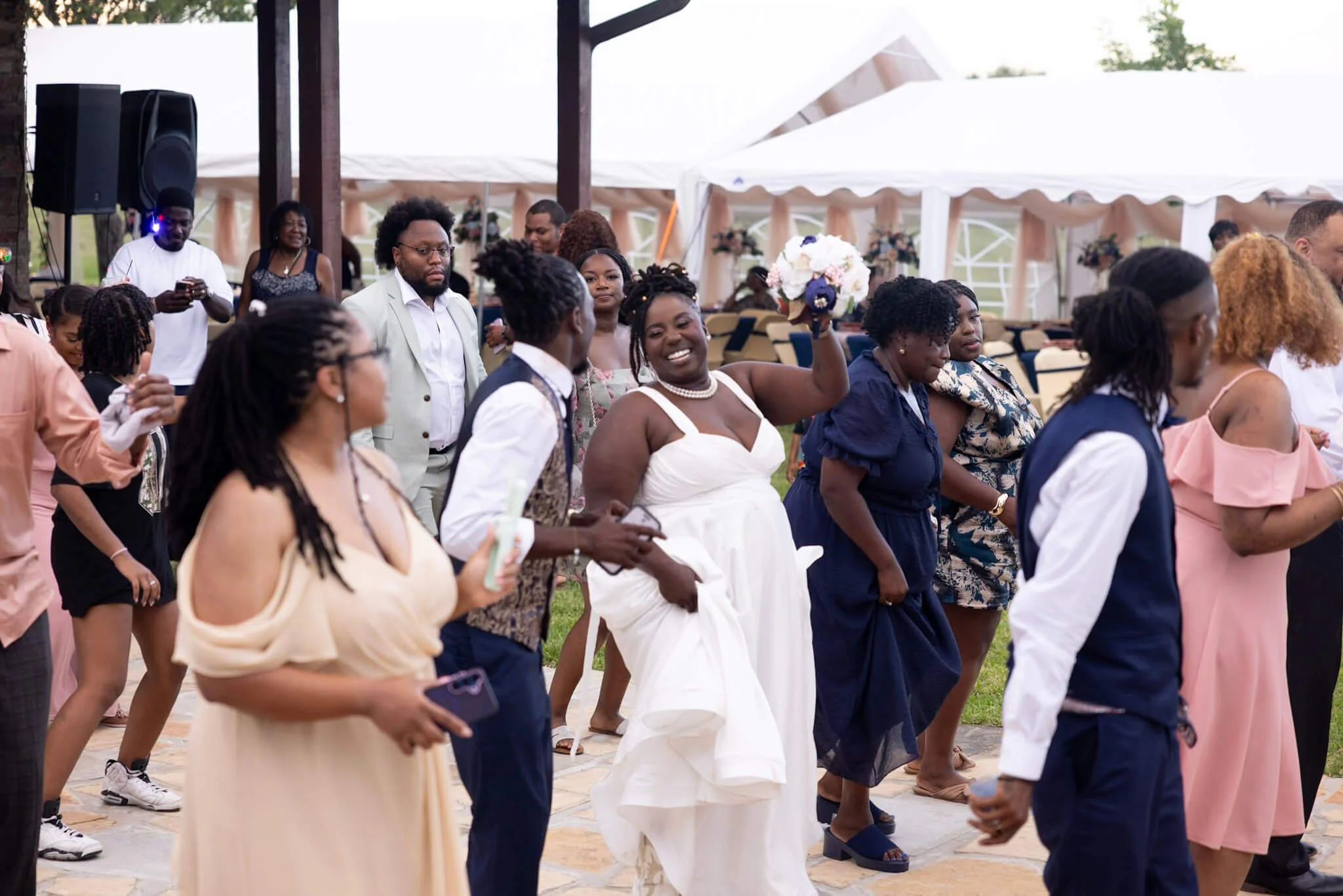 Bride and groom dancing together during their wedding celebration photographed by BeeCaptured