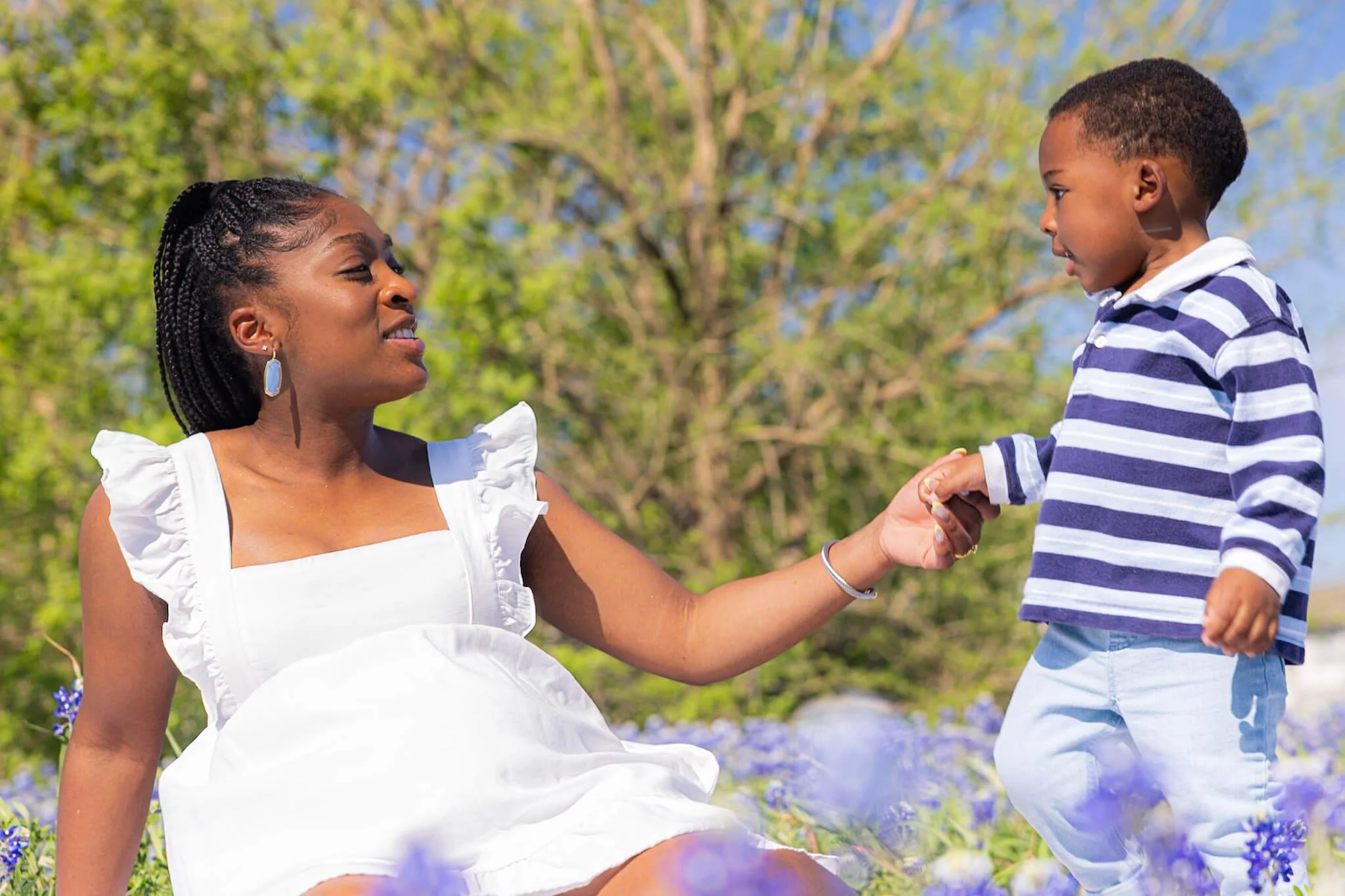 Mother and son photographed in Texas bluebonnets